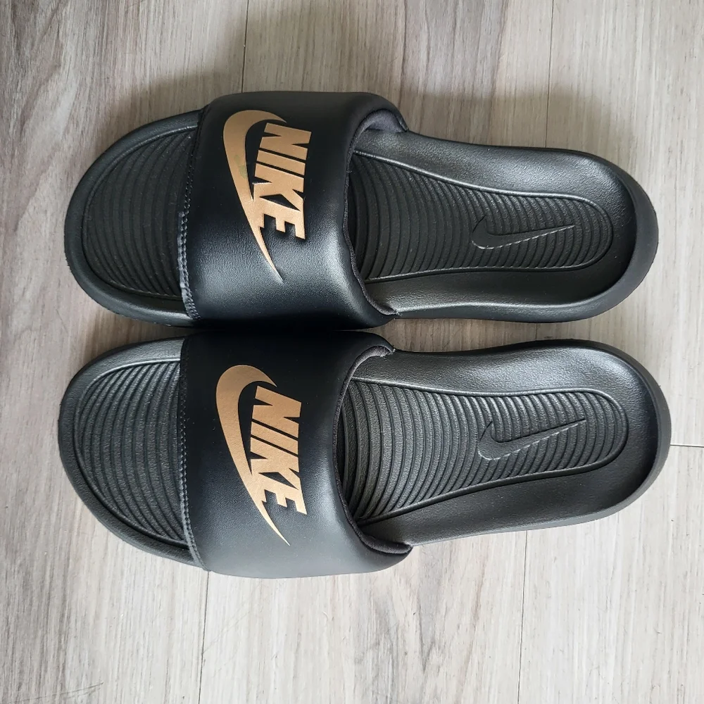 Nike Black Slides with Gold Logo